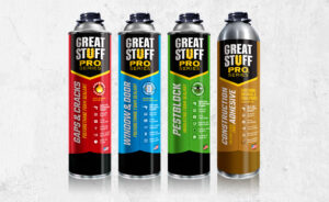 Great Stuff Pro Gaps & Cracks, Great Stuff Pro Window & Door, Great Stuff Pro Pestblock & Great Stuff Pro Construction Adhesive can packaging on concrete background
